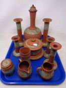 A tray containing 12 pieces of terracotta pottery including milk jugs, candlesticks,