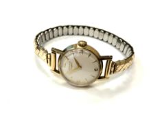 A lady's 9ct yellow gold Longines wristwatch on expansion strap