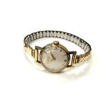 A lady's 9ct yellow gold Longines wristwatch on expansion strap