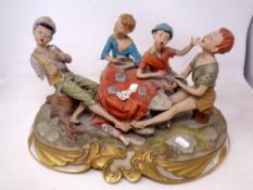 A Capodimonte figure group of a card game.