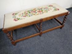 A barley twist duet footstool with tapestry seat.