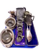A tray containing antique and later metal wares including a pair of graduated pewter tankards,