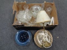 A box containing assorted glassware including blue glass bowl with flower holder,