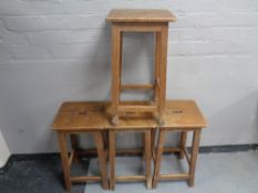 A set of four wooden science lab stools.