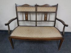 An Edwardian inlaid two seater salon settee