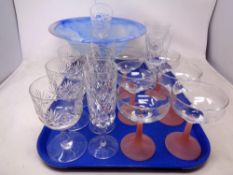 A tray containing assorted drinking glasses together with a blue glass comport.