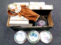 A box containing porcelain headed doll,
