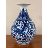 A Chinese blue and white porcelain vase, dragon decoration, base marked in underglaze blue,