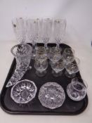 A tray containing assorted glassware including French crystal champagne flutes, horn vase,