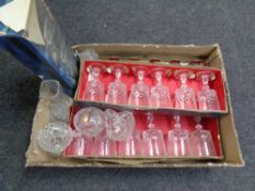 A box containing assorted glassware including boxed French crystal drinking glasses.