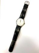 A Gentleman's stainless steel Longines wristwatch on black leather strap, dial width 34 mm.