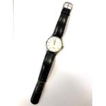 A Gentleman's stainless steel Longines wristwatch on black leather strap, dial width 34 mm.