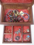 An eastern hardwood jewellery box with brass inlay and lift out tray containing assorted costume