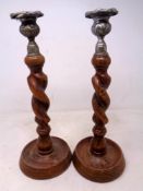 A pair of Edwardian barley twist candlesticks.