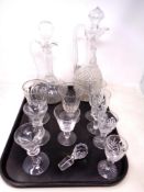 A tray containing antique and later glassware including decanters and glasses,