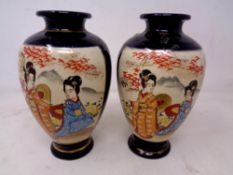 A pair of Japanese Satsuma vases depicting geishas (height 15.5cm).
