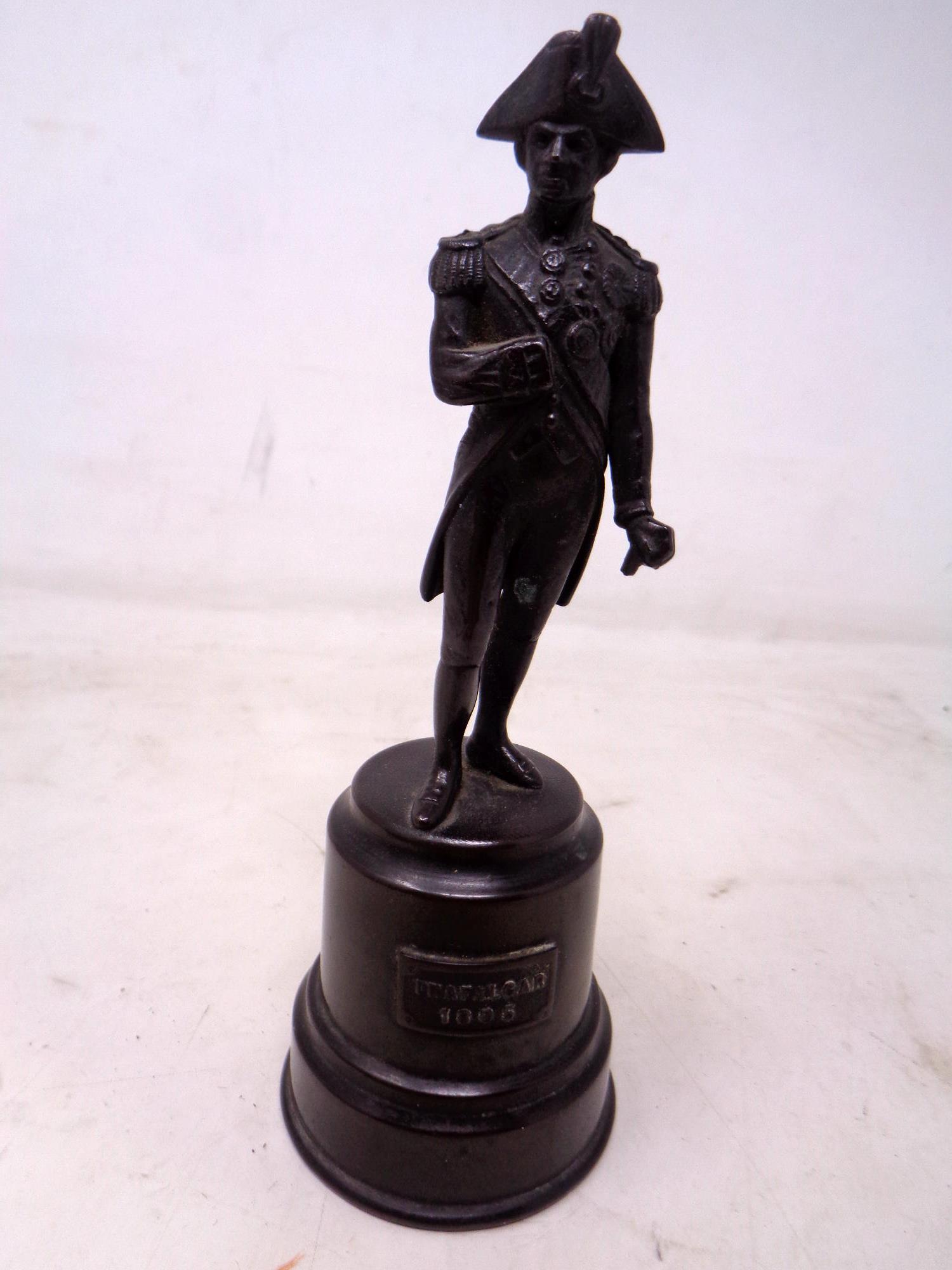A bronze figure of Lord Admiral Nelson (height 14.7cm).