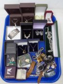 A tray containing a collection of boxed silver and costume jewellery together with a further