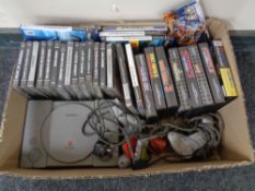 A box containing a Sony Playstation with games and accessories together with further Megadrive and