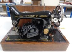 A 20th century Singer sewing machine (electrified) in case.
