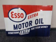 A reproduction Esso motor oil sign.