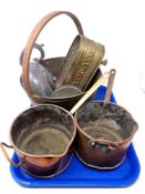 A tray containing antique and later metal ware including two copper saucepans,
