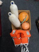 A box containing a life jacket together with two mooring buoys and two further buoys.