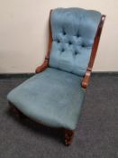 A Victorian mahogany framed nursing chair in blue dralon