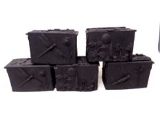 A set of five vintage black plastic embossed trinket boxes.