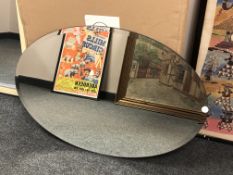 An oval all glass mirror.