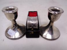A pair of silver squat candlesticks (height 7cm,