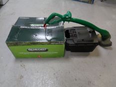 A Qualcast 1300W electric mower in box together with a Qualcast strimmer CONDITION