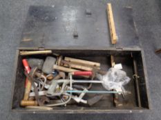 A pine tool box containing vintage hand tools