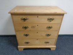 An Edwardian pine four drawer chest.