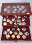 A pocket watch collectors display case fitted with three drawers containing a quantity of