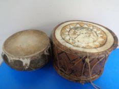 A Yemeni drum together with a further Venezuelan drum.