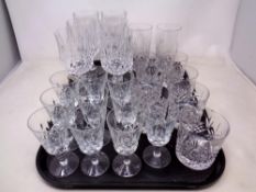 A tray containing assorted cut glass and lead crystal drinking glasses including Edinburgh crystal