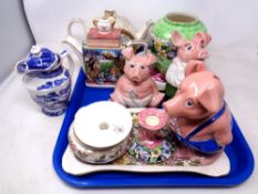 A tray containing assorted ceramics including Maling teapots, three NatWest pigs etc.
