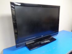 An LG 42" LCD TV with lead and remote.