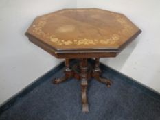 A Victorian octagonal inlaid walnut occasional table on four-way pedestal