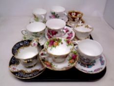 A tray containing nine assorted bone china teacups and saucers including Lady Beth, Royal Albert,