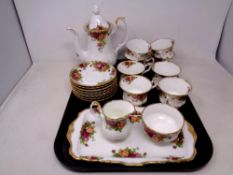 A tray containing a 20 piece Royal Albert Old Country Roses china tea service.
