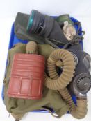 A World War II era gas mask in canvas bag,