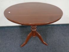 A Victorian mahogany circular tilt top occasional table on three-way pedestal
