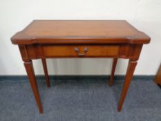 A Victorian style inlaid turn over top card table on reed legs together with two alabaster and gilt