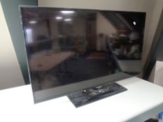 A Samsung 42" LCD Television set, together with the remote control unit.