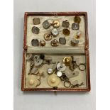 A box of vintage Gentleman's studs including examples in 9ct yellow and white gold with mother of