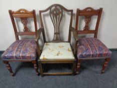 A 19th century elm armchair together with a further pair of Edwardian dining chairs.