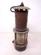 A vintage Wolf miner's lamp.