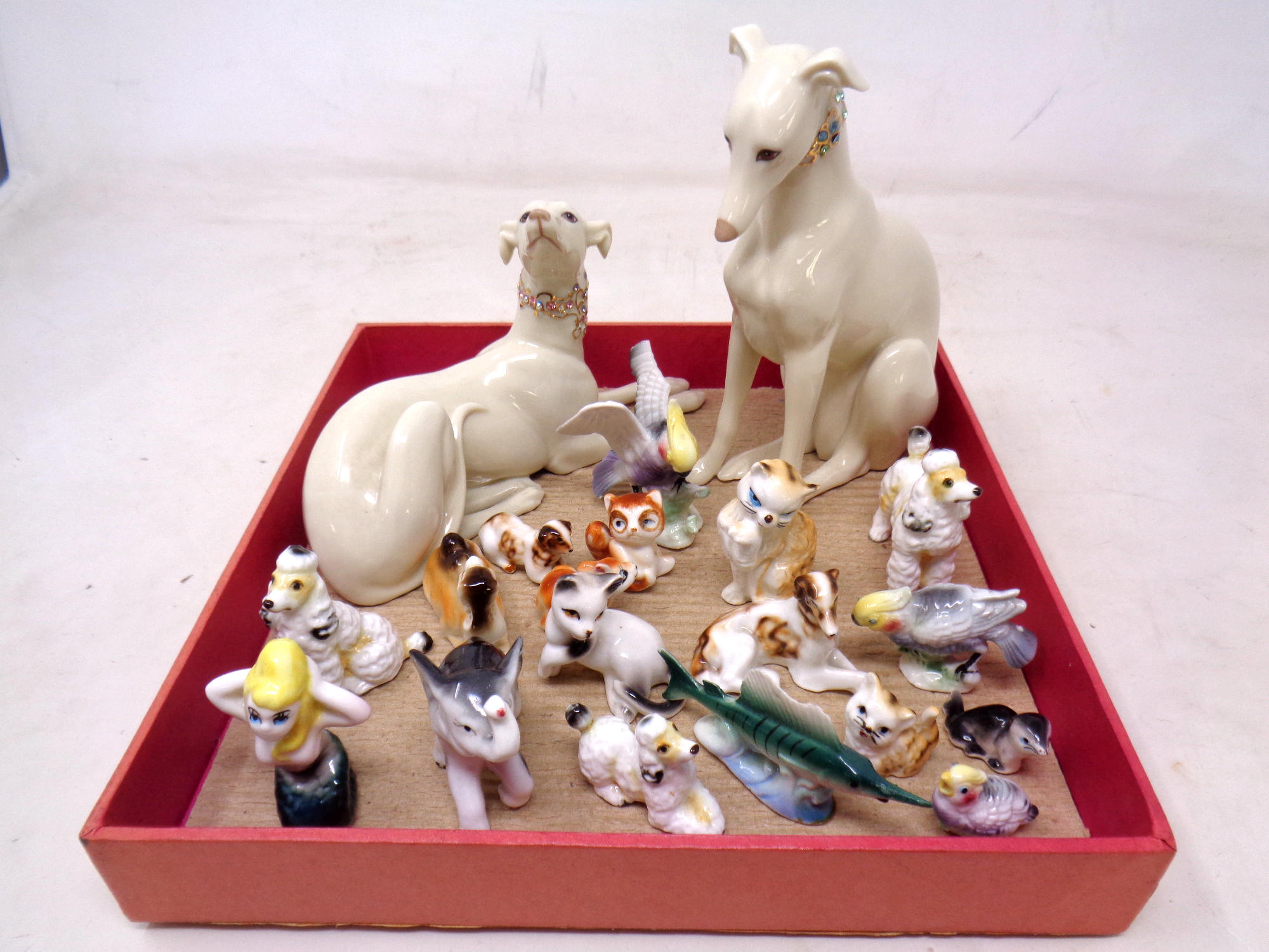 A box containing a collection of miniature ceramic animal ornaments together with two further Lenox